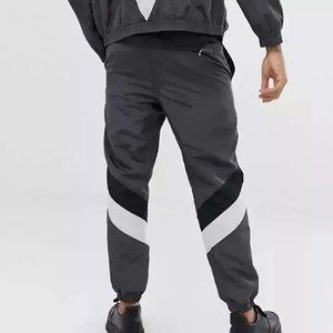 Ensemble de survêtement pour homme avec blocs de couleur, pantalon de jogging sportif à fermeture éclair intégrale avec poches latérales, polyester respirant, idéal pour le printemps - Product Image 4