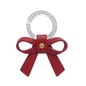 Accesorio de lujo personalizado con lazo rojo y anillo metálico brillante para promoción de joyería, llavero de cuero PU con lazo y dijes. - Product Image 4