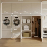 Armoire de buanderie moderne blanche Senger avec niches intégrées pour lave-linge et sèche-linge et étagère à panier à linge extractible