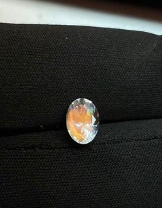 Piedra lunar africana natural facetada, brillante, de corte ovalado, con efecto arcoíris. - Product Image 1