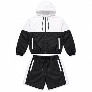 Conjunto Deportivo de Dos Piezas con Capucha, Chaqueta Cortavientos Ligera y Pantalones Cortos para Uso Casual al Aire Libre - Product Image 1