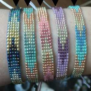 Meilleur bracelet artisanal NOUSHAD fait main avec perles, motifs de pierres diverses, design noir, jaune, argent, certifié IGI, modèle NH-711 - Product Image 1