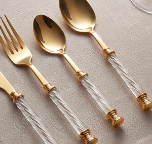 Gold Layered Stainless <b>Utensils</b> <b>With</b> Reflective White Patterned <b>Holders</b> Designed For Classy Table Arrangements - Product Image 1