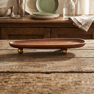 Elegante bandeja ovalada de madera con una textura suave y rica, elevada sobre elegantes patas esféricas de metal, ideal para la decoración del hogar. - Product Image 5