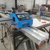 Table de découpe plasma CNC 2000mmx4000mm avec dépoussiéreur industriel pour un environnement de coupe propre en atelier