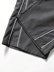 Pantalon de survêtement élégant pour homme, coupe ample et large, avec empiècements contrastants noir et blanc, taille à cordon de serrage, confortable pour le quotidien - Product Image 3