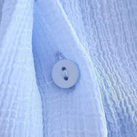 Chemise habillée en coton de luxe pour femme à manches longues avec col boutonné