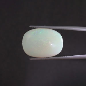 โอปอลสีขาวธรรมชาติ พลอยหลวม 9.01 กะรัต รูปทรงวงรี 20x14 มม. รับรองโดย IGI ขัดเงาด้วยมือ ลงแว็กซ์/น้ำมัน ขายส่งราคาเบาๆ - Product Image 1