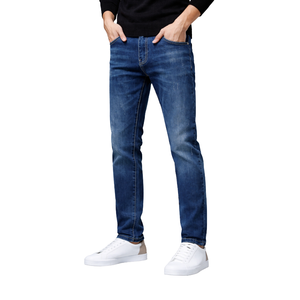 Jean slim bleu foncé pour homme en denim extensible de coton, taille mi-haute, jambe fuselée, finition délavée douce - Product Image 1