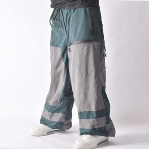 Pantalon de neige vert et gris hiver 2025, style bicolore, taille à cordon de serrage, poches zippées de rangement et système de ventilation - Product Image 1