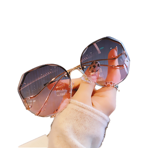 Gafas de Sol de Moda de Lujo al por Mayor, Montura Poligonal sin Aro, Protección UV, Unisex, para Viajes y Conducción - Product Image 1