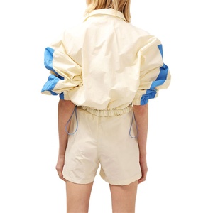 Ensemble de survêtement coupe-vent deux pièces pour femme, haut long, couleur unie, avec dentelle et boutons, imperméable, écologique, pour l'été, vente en gros personnalisée - Product Image 3
