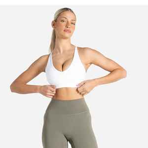 Sujetador deportivo sin costuras con cuello en V profundo y espalda cruzada para mujer, soporte medio, yoga, color liso, tela elástica - Product Image 1
