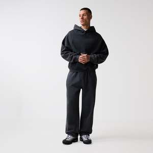 Ensemble de survêtement surdimensionné pour homme, comprenant un sweat à capuche ample et un pantalon de survêtement, en coton épais 100% avec logo personnalisé et effet délavé. - Product Image 1