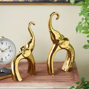 Set of Two Gold <b>Elephant</b> Metal Sculptures with Raised Trunks Luxury <b>Table</b> Decor for Home Office and Gifting - Product Image 1