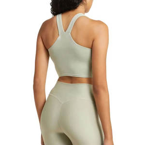 Top deportivo corto de yoga para gimnasio y entrenamiento, con logo personalizado OEM, de secado rápido, con dobladillo curvo, para mujer. - Product Image 4