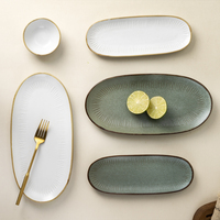 YAYU OEM ODM Assiettes ovales en porcelaine vert foncé, vaisselle à gâteau de fruits blanc moucheté, assiette à dessert en céramique pour restaurant thaïlandais