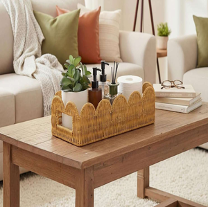 <b>Square</b> natural woven storage <b>basket</b> featuring side cut-out handles, arranged on a sofa available at wholesale prices. - Product Image 4