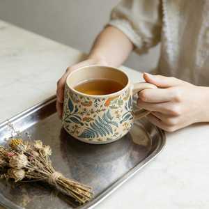 Taza de cerámica de gres grueso para té y café con asa de porcelana, de Universal Overseas - Product Image 2