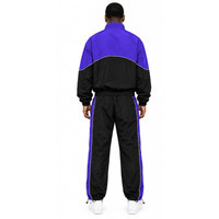 Ensemble de survêtement deux pièces pour homme : veste coupe-vent à col montant zippée et pantalon color block violet et noir