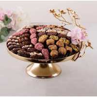 Plateau de service rond élégant en acier inoxydable miroir argenté de luxe pour présentation de chocolats et buffet de mariage