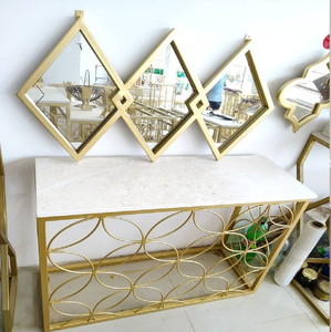 Sculptural <b>console</b> <b>table</b> with a dark glass top and elegant silver curved ribbon <b>legs</b>, available at wholesale prices. - Product Image 4