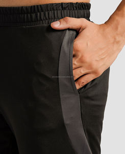 กางเกงขาสั้นฮิปฮอปเอวกลางสำหรับผู้ชาย ระบายอากาศได้ดี กันลม แห้งเร็ว ผ้าลูกฟูก สีพื้น มีเชือกผูก ปิดด้านซ้าย โพลีเอสเตอร์ 100% - Product Image 4