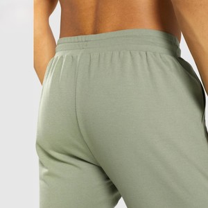 Pantalon de survêtement en molleton épais pour homme avec cordon de serrage ajustable à la taille, tissu extensible, poches latérales fonctionnelles, style athlétique moderne - Product Image 3