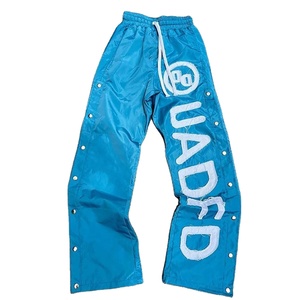 Pantalones de pierna ancha de nailon transpirable para hombre, botones laterales a presión, apliques estampados con logotipo personalizado, parche bordado, diseño de cordón de verano - Product Image 1