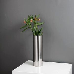 <b>Unique</b> metal flower <b>vase</b> expressing creative excellence ideal for enhancing rooms with fashionable metallic accent - Product Image 1