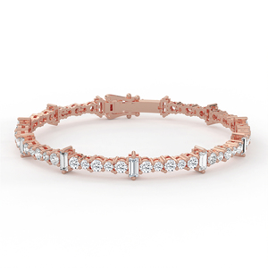 Sofisticada pulsera de tenis con diamantes de corte redondo y baguette alternados, en oro de 14k y 18k, con diseño de eslabones rítmicos. - Product Image 1