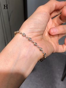 Pulsera de tenis con diamantes ovalados y redondos engastados en bisel, de oro de 14K, con cadena de eslabones y múltiples piedras alternadas. - Product Image 5