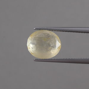 พลอยแซฟไฟร์สีเหลืองธรรมชาติทรงรีขนาด 11.5x10 มม. น้ำหนัก 6.92 กะรัต ได้รับการรับรองจาก IGI สำหรับทำเครื่องประดับ ขนาด 6 มม.  ขัดเงา/เคลือบน้ำมัน 100% จากธรรมชาติ - Product Image 1