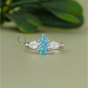 Vivid Blue 1.61 CT Pear Cut Lab Grown Diamond Three Stone Ring in 14K White Gold with Prong Setting - Product Image 1
