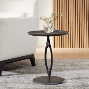 Modern iron side <b>table</b> with sleek <b>round</b> top and sculpted base for stylish living room decor durable design and versatile - Product Image 1