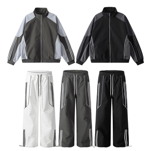Ensemble de survêtement sportif unisexe à manches longues avec veste zippée color block et pantalon à cordon de serrage, séchage rapide, en polyester, pour l'automne - Product Image 1