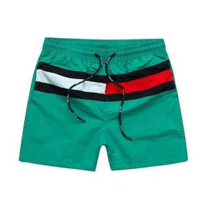 Shorts de bain pour hommes bleus avec bande latérale rouge, blanche et noire, séchage rapide, taille à cordon de serrage, décontractés - Product Image 2