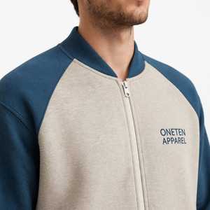 เสื้อแจ็คเก็ตวินเทจแบบมีฮู้ด แบรนด์ Oneten Apparel รุ่น Unisex สีเบจ-น้ำเงิน แต่งลายปักการ์ตูน แขนเสื้อแบบแร็กแลน ซิปหน้า เหมาะสำหรับฤดูใบไม้ร่วง - Product Image 5