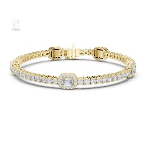 Exquisite Gold Tennis <b>Bracelet</b> Featuring Emerald Cut Centerpiece and Round Diamond Halo - Product Image 1