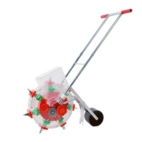 Semoir manuel à pousser la main Machine à semer Semoir de maïs Semoir de légumes Engrais de maïs Semences de blé Semis à goutte Ferme