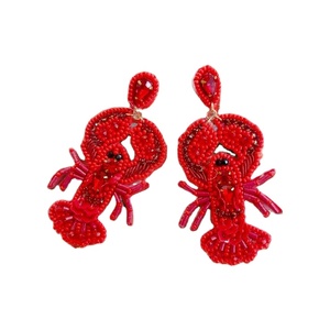 Pendientes largos de estilo bohemio con cuentas de hilo rojo y borlas de cuentas de semillas, joyería para mujer de la India. - Product Image 1