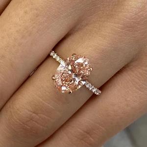 Anillo de Compromiso con Diamante Ovalado Rosa de Lujo con Piedras Laterales Redondas, Anillo Halo de Oro Rosa de 14K, Regalo de Aniversario, Joyería Fina para Novia - Product Image 1