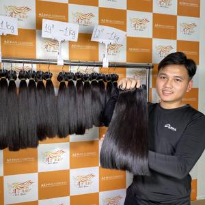 Vente en gros 30 pouces paquets de cheveux vietnamiens bruts vierges perruque de trame droite en os supérieur de couleur noire naturelle de haute qualité Vietnam - Product Image 1