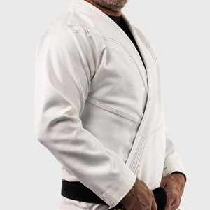 Uniforme de Entrenamiento 100% Algodón Elástico Ligero Transpirable Sin Costuras Unisex Profesional con Logotipo Personalizado Kimono de Jiu Jitsu BJJ - Product Image 1