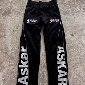 Pantalon de survêtement noir pour homme, taille élastique, cordon de serrage, fermeture éclair latérale, décontracté, en coton, style automne, vente en gros - Product Image 1