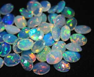 Piedra preciosa de ópalo etíope facetado de 8*10 mm, forma ovalada, cabujón, calidad súper fina para suministro de joyería. - Product Image 1