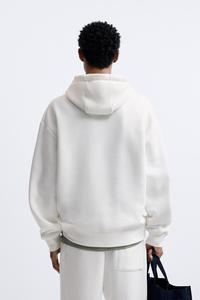 เสื้อสเวตเชิ้ตมีฮู้ดสีขาวสำหรับผู้ชาย ทรงหลวม ใส่สบาย สีพื้น ผ้าฝ้าย 100% น้ำหนักปานกลาง มีกระเป๋าข้าง มีเชือกผูก เหมาะสำหรับฤดูใบไม้ร่วง - Product Image 2