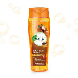Champú reparador de daños con infusión de argán y arroz negro, enriquecido con colágeno vegetal y vitamina C para cabello seco, dañado y encrespado. - Product Image 1