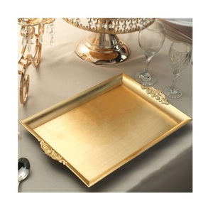 Bandeja decorativa dorada de acero inoxidable utilizada en hoteles, restaurantes y hogares - Product Image 1