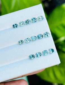 พลอยเพทายสีฟ้าธรรมชาติทรงรี รับรองโดย IGI น้ำหนักรวมเบา สำหรับทำเครื่องประดับ แหวน จี้ ต่างหู - Product Image 1